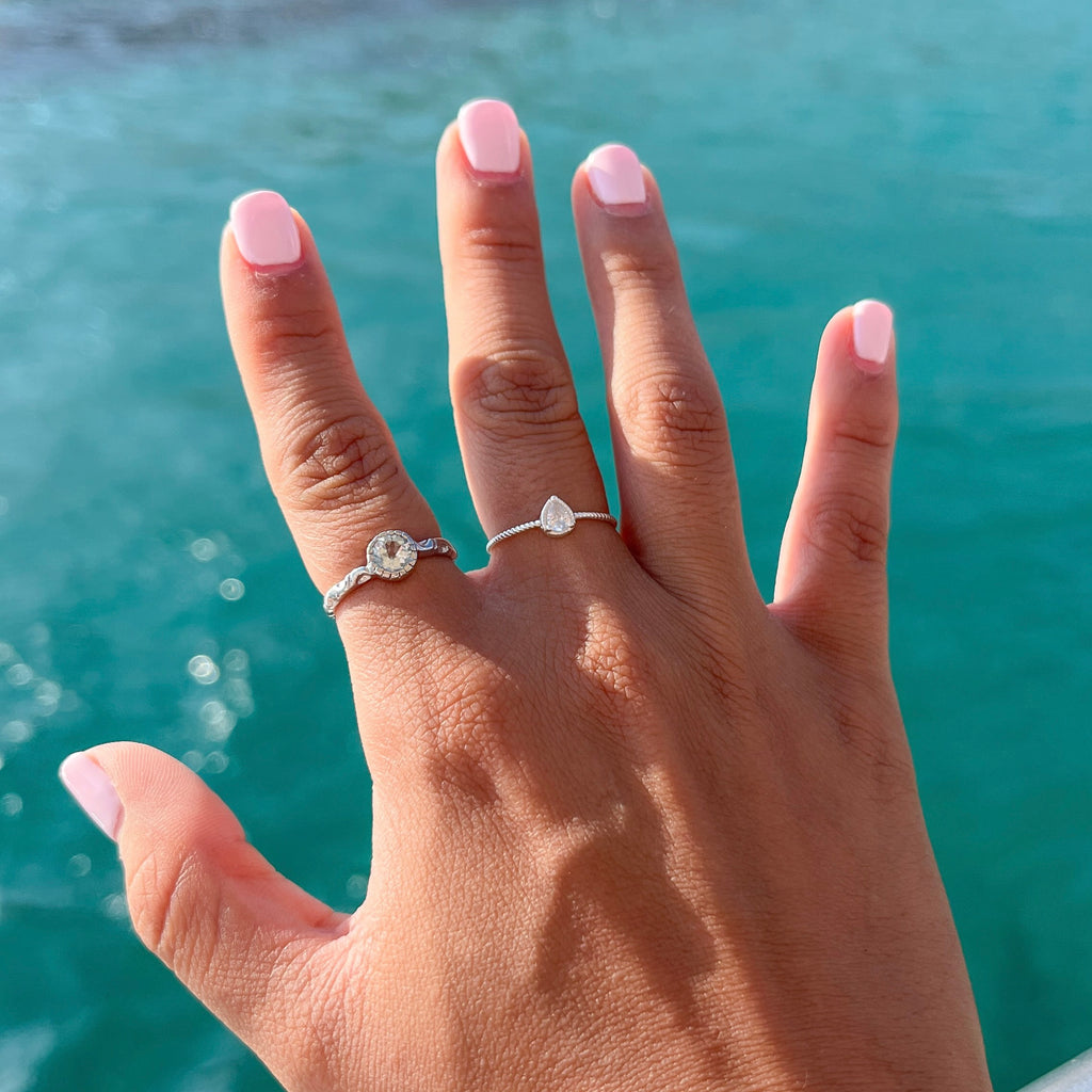 Captivating Blue Topaz Solitaire Ring in Rhodium-Plated Sterling Silver
