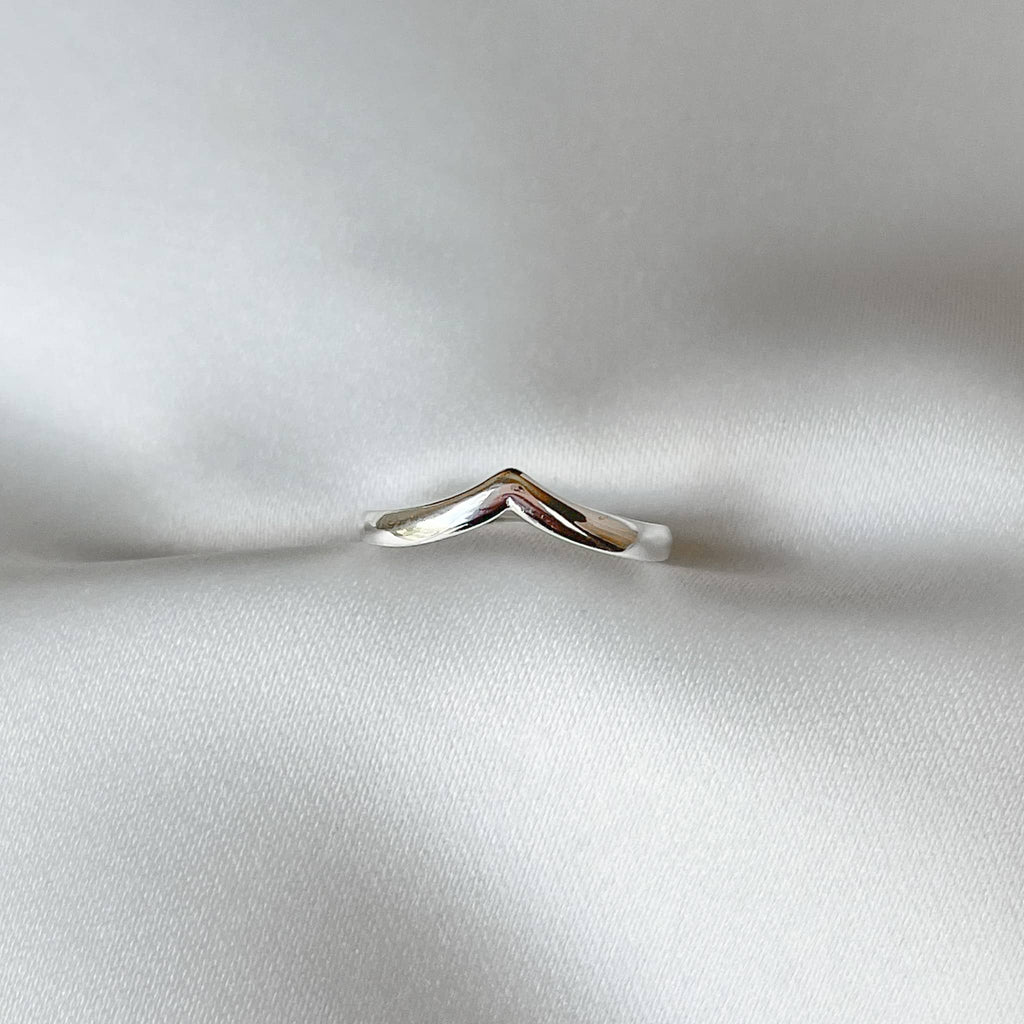terling silver chevron ring displayed against a neutral background.