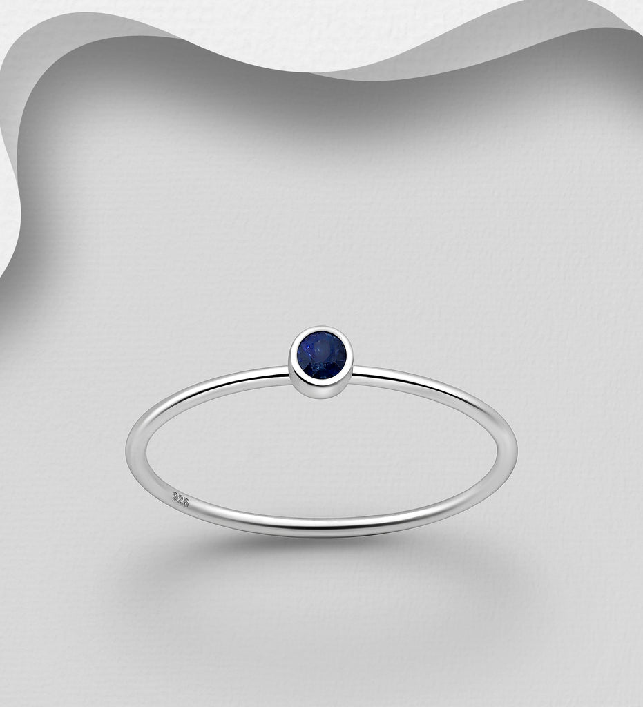925 sterling silver ring with blue sapphire stone.