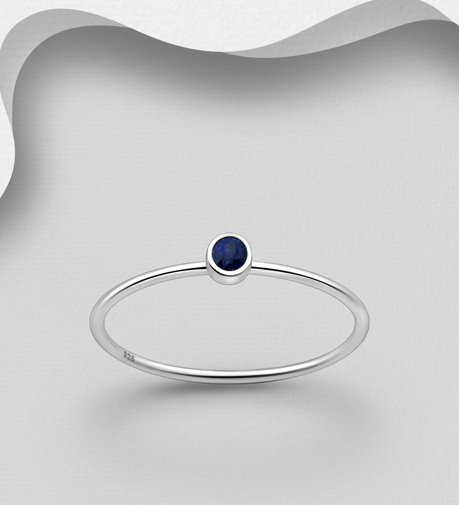925 sterling silver ring with blue sapphire stone.